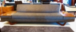 Sleek 1960&#39;s European-made sofa with built in teak side tables
Fully restored and reupholstered.